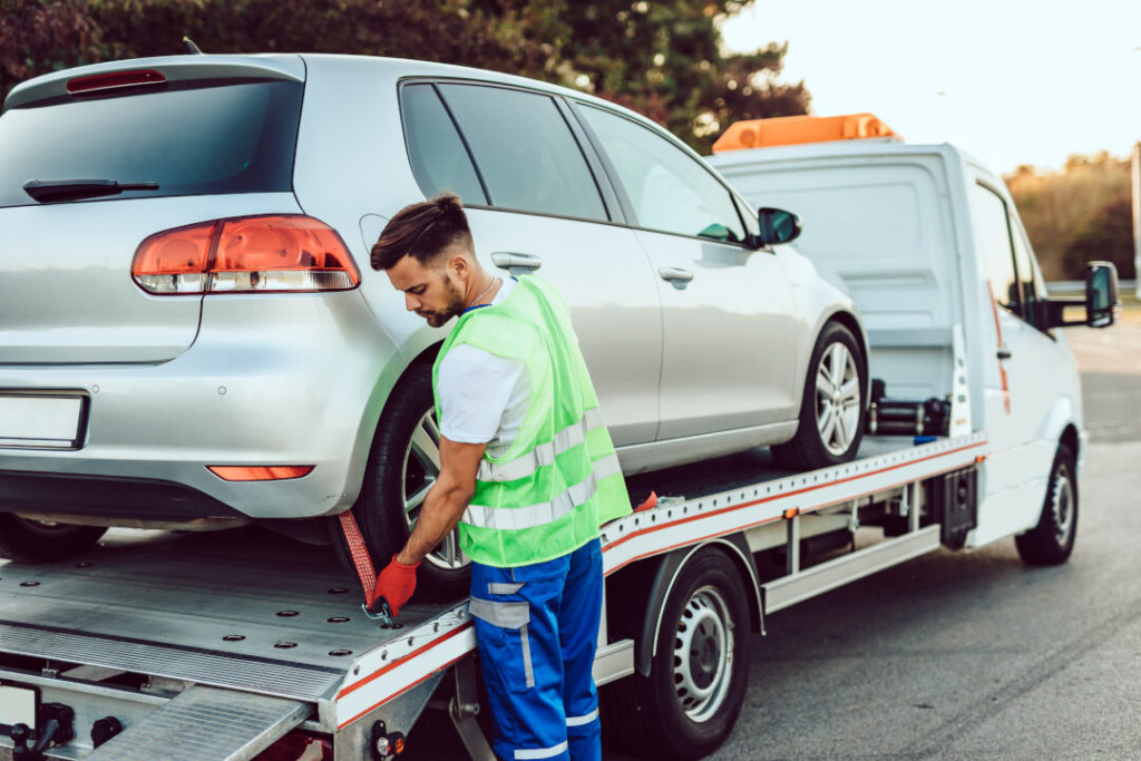 Man Working In Towing Service On The Road