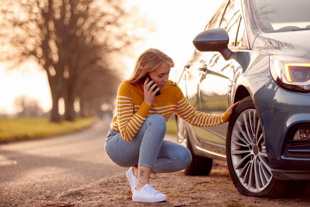 a woman waiting for vehicle recovery